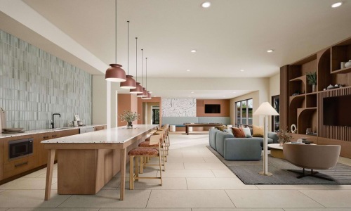a clubroom with a table, chairs and a couch