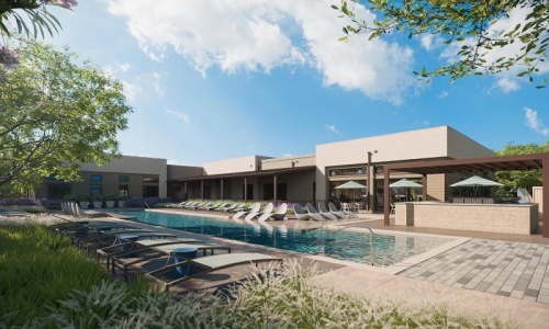 a swimming pool in front of a building