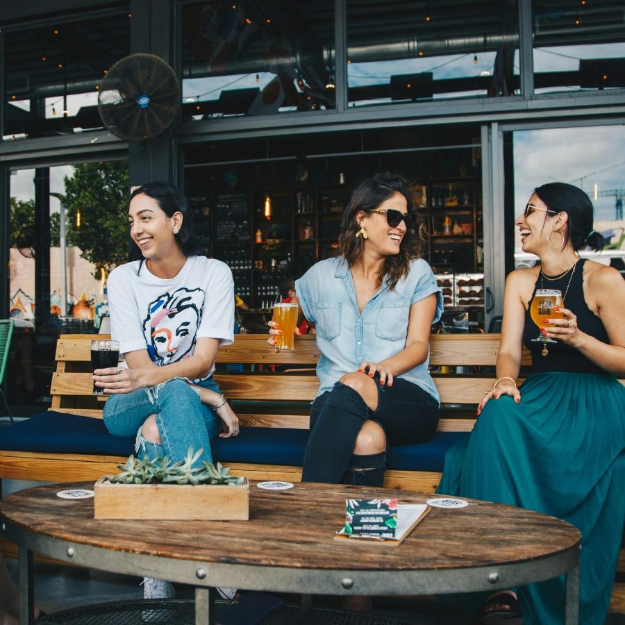 a group of people sitting at a table with drinks
