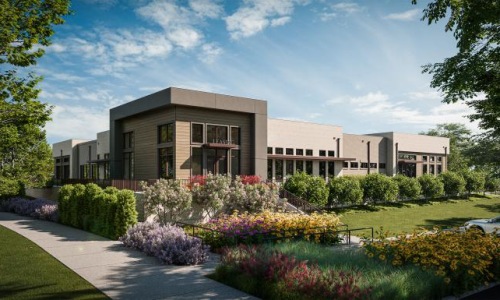 a building with a garden in front